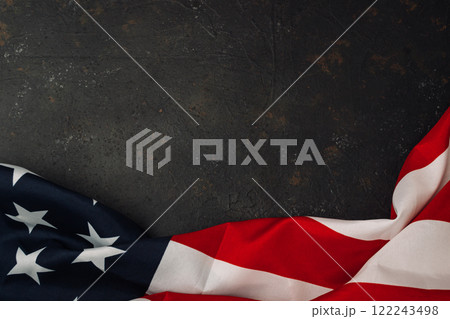 Red and white American flag is displayed on a black background Red and white American flag is displayed on a black background 122243498