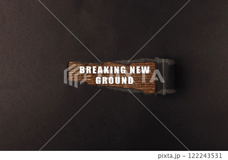 Wooden sign that says Breaking New Ground Wooden sign that says Breaking New Ground 122243531