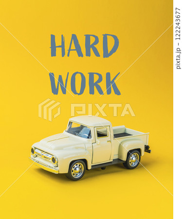 A toy truck with the words hard work written on it 122243677