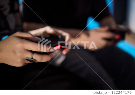Enjoy an exciting gaming session with a handheld console full of thrills and adventures 122244179