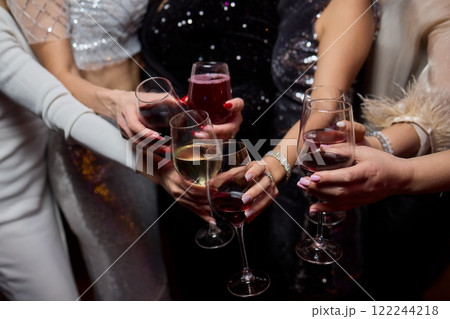 Cheers to a Fantastic Celebration Friends Joyfully Toasting with Wine Glasses in Hand 122244218