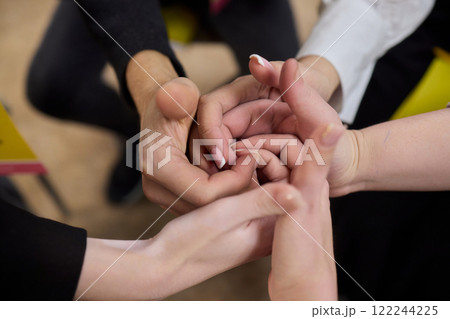 A Symbolic Union of Hands Captured in an Intertwined Gesture Expressing Connection and Affection 122244225