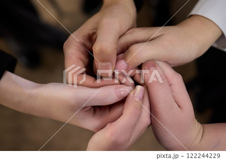 A Symbolic Union of Hands Captured in an Intertwined Gesture Expressing Connection and Affection 122244229