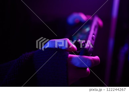 Enjoy an exciting gaming session with a handheld console full of thrills and adventures Enjoy an exciting gaming session with a handheld console full of thrills and adventures 122244267