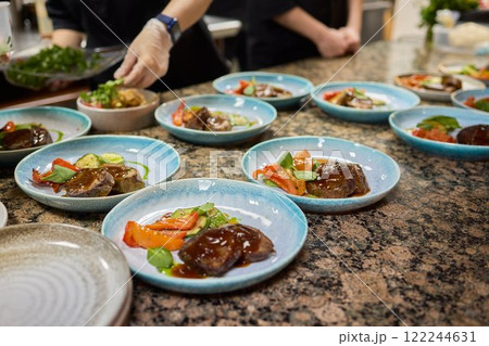 Experience the art of preparing gourmet meals in a high end professional kitchen 122244631