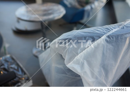 Plastic covered chairs in a modern office setting create an intriguing aesthetic Plastic covered chairs in a modern office setting create an intriguing aesthetic 122244661