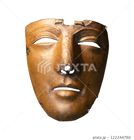 Damaged bronze mask on white background 122244760