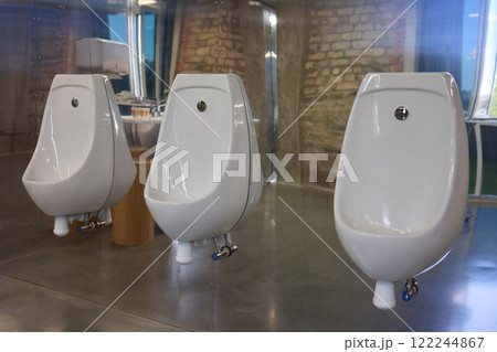 The design of modern urinals plays a vital role in establishing a contemporary restroom experience 122244867