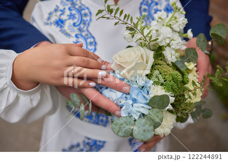A stunning and beautiful floral bouquet featuring lovely eucalyptus and vibrant blue hydrangeas 122244891
