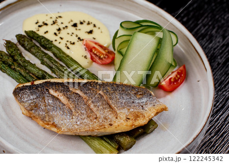 Close-Up of Grilled Sea Bass with Asparagus. 122245342