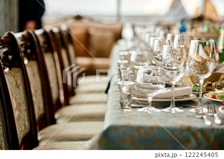 Elegant Table Setting with Glassware and Plates. 122245405