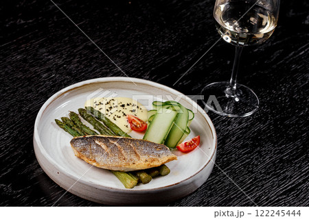 Grilled Sea Bass with Asparagus and Hollandaise Sauce. 122245444