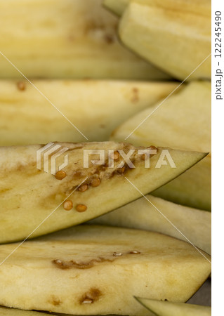 the flesh and seeds of sliced ripe eggplant 122245490