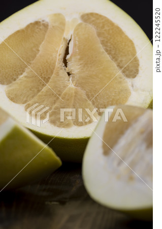 ripe pomelo with lots of pulp cut into pieces 122245520