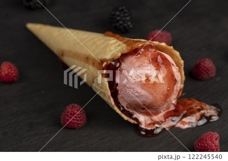 pink creamy raspberry flavored ice cream with red raspberry berries pink creamy raspberry flavored ice cream with red raspberry berries 122245540