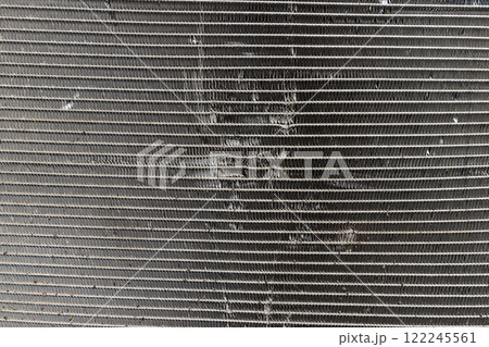 an old car radiator made of lead damaged after an accident an old car radiator made of lead damaged after an accident 122245561