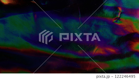 Dark gradient. Foil texture. Blurred colorful holographic flow. Wavy spectrum mesh flare. Illumination dimming background. Glossy rainbow surface. Dark gradient. Foil texture. Blurred colorful holographic flow. Wavy spectrum mesh flare. Illumination dimming background. Glossy rainbow surface. 122246495