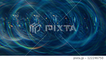 Confetti glaring. Defocused reflection. Colorful blue color particles sparkling beam flickers moving on abstract bokeh dark background. Confetti glaring. Defocused reflection. Colorful blue color particles sparkling beam flickers moving on abstract bokeh dark background. 122246750