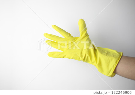 Housekeeping concept. Hand in yellow glove showing Housekeeping concept. Hand in yellow glove showing 122246906