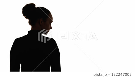 Upset silhouette. Loneliness melancholy. Dark contrast back view outline of sad depressed woman isolated on white copy space background. Upset silhouette. Loneliness melancholy. Dark contrast back view outline of sad depressed woman isolated on white copy space background. 122247005