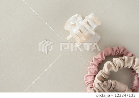 Neutral minimal hair clip and hair ties close-up Neutral minimal hair clip and hair ties close-up 122247133