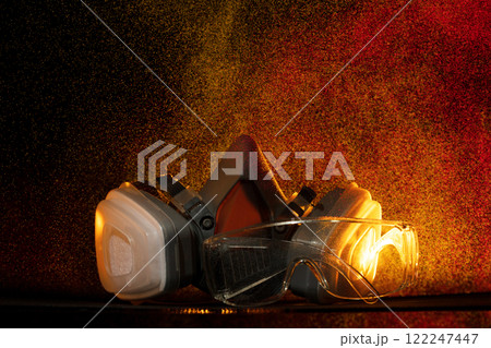 In rain spray of toxic chemicals, mask is essential object for health safety. Combined with protective glasses, industrial gas mask offers vital protection against gas, smoke, dust, and pollution 122247447