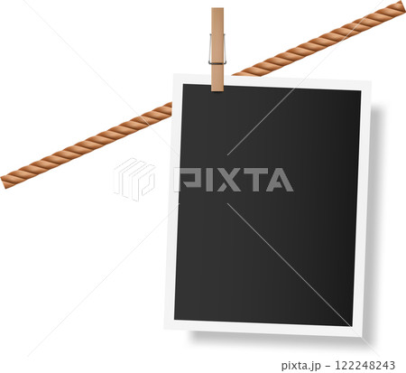 Blank vintage photo template hanging on clothesline with wooden clothespin, creating a nostalgic and customizable backdrop for memories and creative projects 122248243