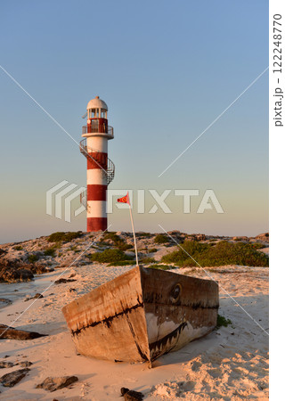 Lighthouse on a rocky shore in Cancun. Clear sky and blue sea. Mexico. 122248770