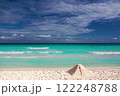 Pyramid of sand on the shores of the Caribbean Sea. 122248788