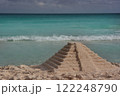 Pyramid of sand on the shores of the Caribbean Sea. 122248790