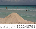 Pyramid of sand on the shores of the Caribbean Sea. 122248791