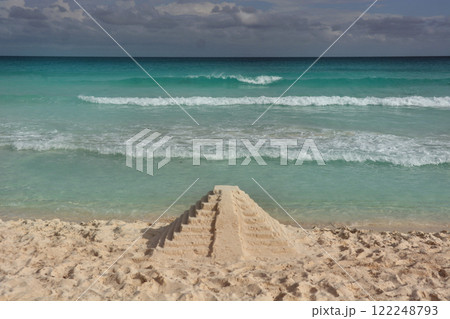 Pyramid of sand on the shores of the Caribbean Sea. 122248793