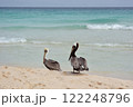 Big Pelican flies over the sea against a blue sky. 122248796