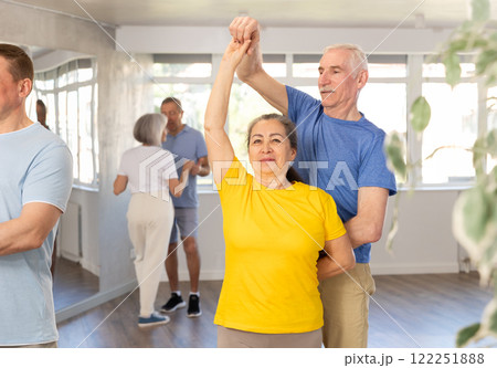 Couple of elderly man and woman dancing waltz Couple of elderly man and woman dancing waltz 122251888