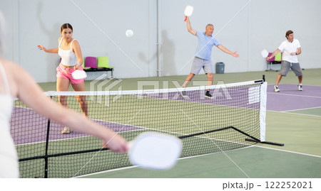 Expressive young girl playing pickleball in indoor court Expressive young girl playing pickleball in indoor court 122252021