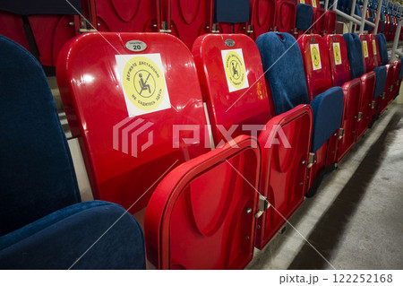 locked chairs at the stadium during the pandemic 122252168