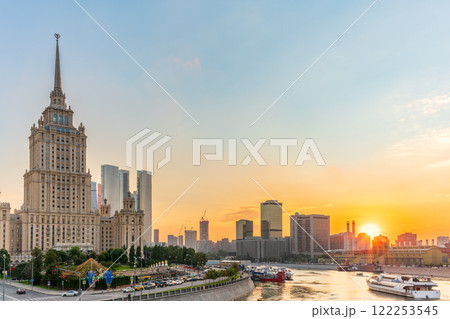High-rise stalinist building near river at summer sunset in Moscow, Russia. Historic name is Hotel Ukraine. 122253545