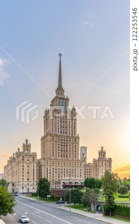 High-rise stalinist building near river at summer sunset in Moscow, Russia. Historic name is Hotel Ukraine. 122253546