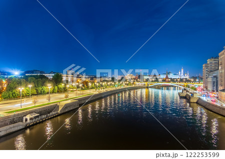 Illuminated Moscow Kremlin and Bolshoy Kamenny Bridge at summer night. View from the Patriarshy pedestrian Bridge Illuminated Moscow Kremlin and Bolshoy Kamenny Bridge at summer night. View from the Patriarshy pedestrian Bridge 122253599