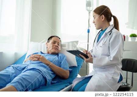 A female doctor gives a health examination consultation and explains the details of health care to a patient in the clinic. A female doctor gives a health examination consultation and explains the details of health care to a patient in the clinic. 122254115
