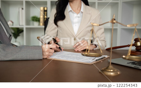 Lawyer and businesswomen discussing and introducing Providing legal advice regarding signing insurance contracts or financial contracts Lawyer and businesswomen discussing and introducing Providing legal advice regarding signing insurance contracts or financial contracts 122254343