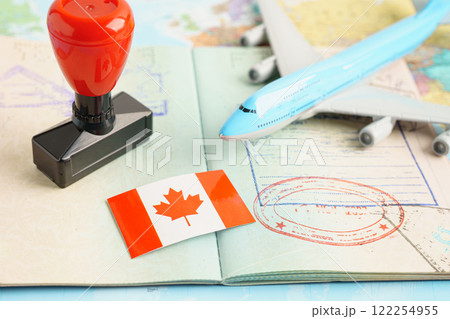 Canada passport with approved stamp on document for tourism to immigration at airport in country. Canada passport with approved stamp on document for tourism to immigration at airport in country. 122254955