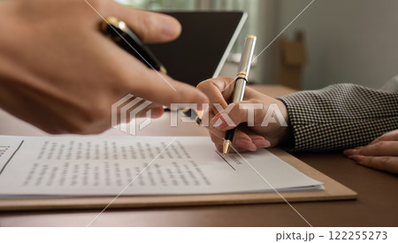 Lawyer and businesswomen discussing and introducing Providing legal advice regarding signing insurance contracts or financial contracts Lawyer and businesswomen discussing and introducing Providing legal advice regarding signing insurance contracts or financial contracts 122255273