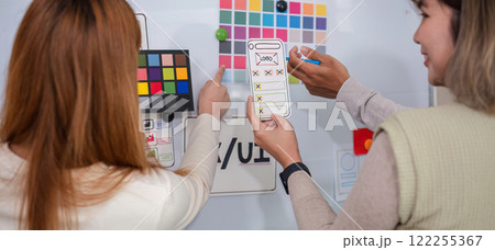 Creative team of designers in application design and ux ui usability planning. Modern business team teamwork. 122255367