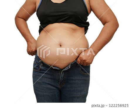 Asian woman show fat belly big size overweight and obesity isolated on white background. Asian woman show fat belly big size overweight and obesity isolated on white background. 122256925