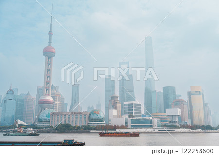 Cityscape view of Shanghai city in the morning. Skyscraper of Lujiazui in Pudong, view from The Bund of Shanghai, China. landmark and popular for tourism attractions. Travel and Vacation concept Cityscape view of Shanghai city in the morning. Skyscraper of Lujiazui in Pudong, view from The Bund of Shanghai, China. landmark and popular for tourism attractions. Travel and Vacation concept 122258600