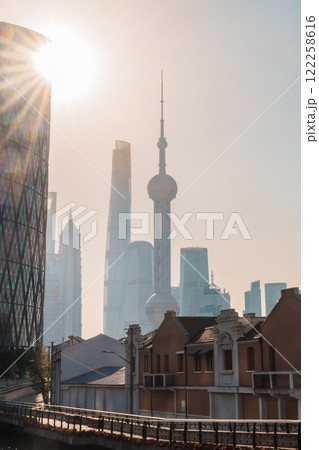 Cityscape view of Shanghai city in the morning. Skyscraper of Lujiazui in Pudong, view from Hongkou Gang canal of Shanghai, China. landmark and popular for tourism attraction. Travel and vacation Cityscape view of Shanghai city in the morning. Skyscraper of Lujiazui in Pudong, view from Hongkou Gang canal of Shanghai, China. landmark and popular for tourism attraction. Travel and vacation 122258616