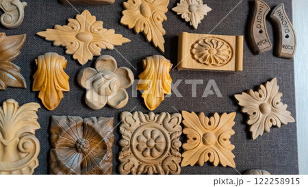 carving element. furniture in classic style. white color wood with gold trim. patina. carving. small depth of field. luxury furniture. use as background. carving element. furniture in classic style. white color wood with gold trim. patina. carving. small depth of field. luxury furniture. use as background. 122258915