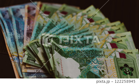 Currencies and money exchange trading concepts. Qatari 500 Riyals Bank Note . Qatari Currency roll Currencies and money exchange trading concepts. Qatari 500 Riyals Bank Note . Qatari Currency roll 122258945