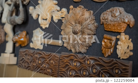 carving element. furniture in classic style. white color wood with gold trim. patina. carving. small depth of field. luxury furniture. use as background. 122259004